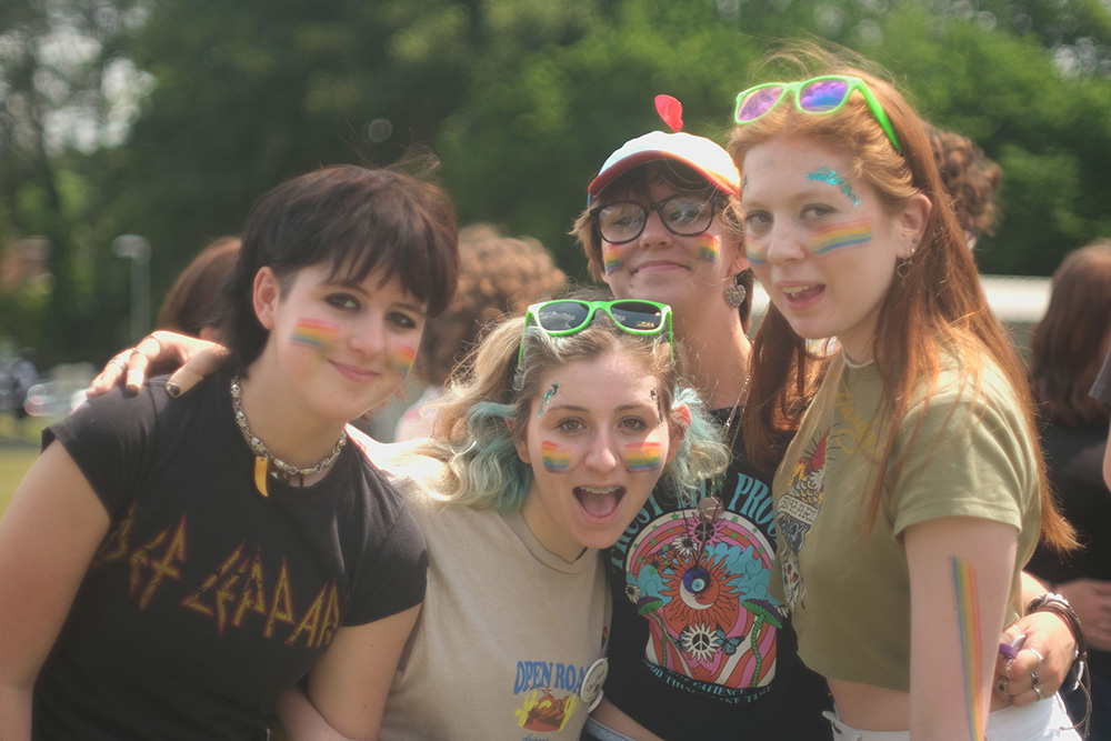Students wearing face paint enjoying the Pride Festival Students wearing face paint enjoying the Pride Festival