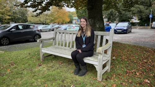 Image of student outside AHED building